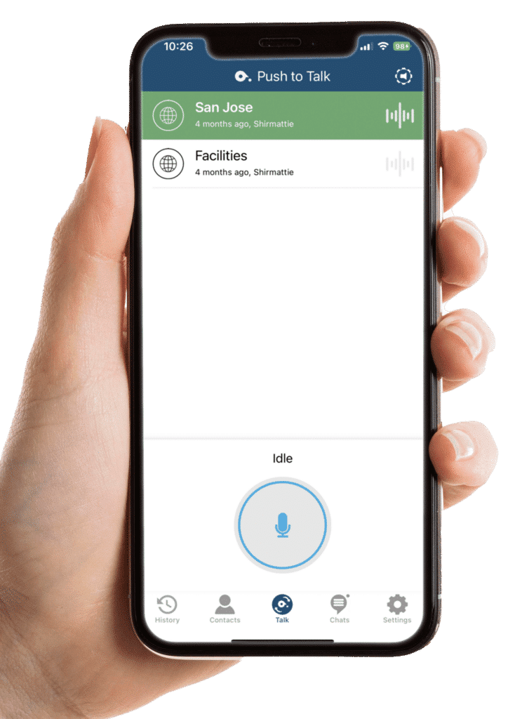 A hand holding a smartphone displays the push-to-talk (PTT) screen with talk groups and the PTT button.