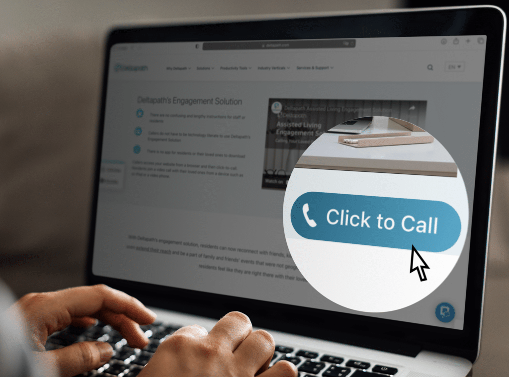 A person is browsing a website on a laptop. The person is just about to click on the click to call button to speak to an agent.
